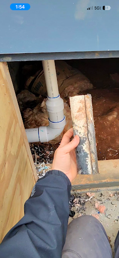 PVC drain pipe repair under cabinet — drain cleaning service